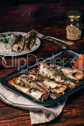 Baked fish carcasses on baking sheet