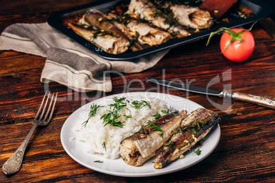 Baked hake carcasses with rice