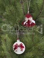 Traditional christmas hand made decoration hanging on fir tree.