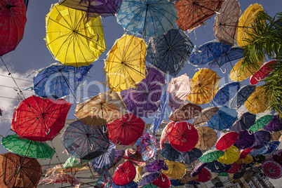 Colored umbrellas suspended in the air 2