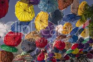Colored umbrellas suspended in the air 2