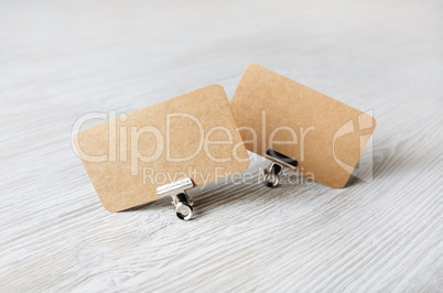 Two kraft business cards