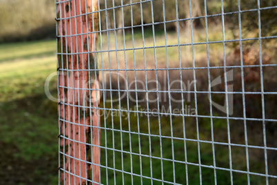 Metal mesh is attached on a wooden pole