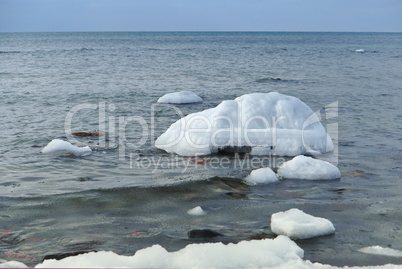 the sea is frozen, pierce in the ice, the sea coast in the ice winter on the Baltic sea, icing on the seafront