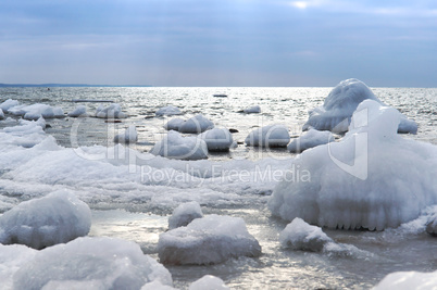 the sea is frozen, pierce in the ice, the sea coast in the ice winter on the Baltic sea, icing on the seafront