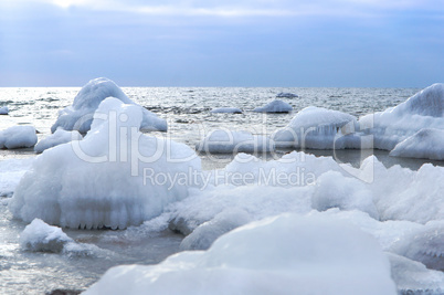 the sea is frozen, pierce in the ice, the sea coast in the ice winter on the Baltic sea, icing on the seafront