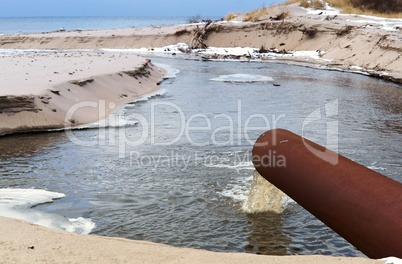 sewer pipe into the sea, the dirty drain waste water, environmental pollution