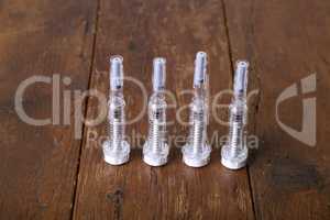 Plastic syringe with hypodermic needle against thrombosis