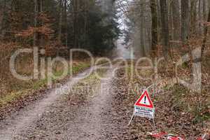 Forest - Text in German: woodcutting. Risk of death. Do Not Enter