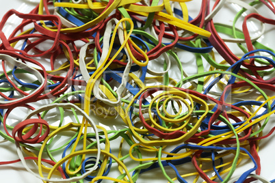 Elastic multicolored elastic bands lie on a table