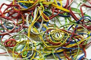 Elastic multicolored elastic bands lie on a table