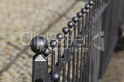 Strong metal fence around the apartment building