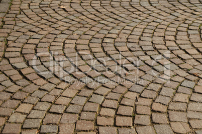 Abstract background of old cobblestone pavement close-up