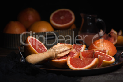 Juicer  squeezing juice from grapefruit
