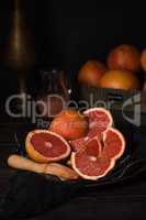 Juicer with squeezed grapefruit half on dish