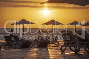 Parasols and sunbeds create a sunset silhouette 2