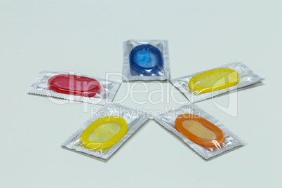 Packs of colorful condoms lie on a table