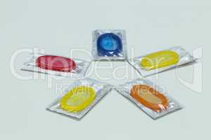 Packs of colorful condoms lie on a table