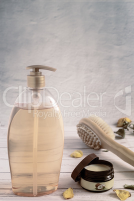 Shower gel, massage brush and skin cream.