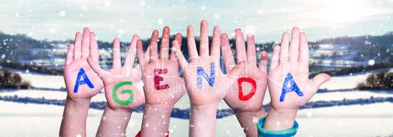 Children Hands Building Word Agenda, Snowy Winter Background
