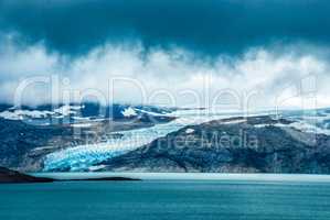Glacier In Norway, Beautiful Landscape With Cold Cloudy Sky, Blue Lake