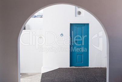 Beautiful White Building and Blue Door Entrance in Santorini Gre