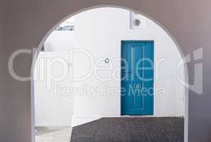 Beautiful White Building and Blue Door Entrance in Santorini Gre
