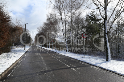 First snow. Winter landscape with snow-covered road