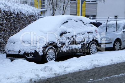 A Car covered with fresh white snow