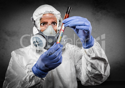 Female Doctor or Nurse In Hazmat Gear Holding Positive Coronavir