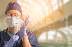 Female Doctor or Nurse Wearing Protective Face Mask and Surgical