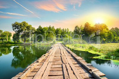 Wooden bridge at sunset