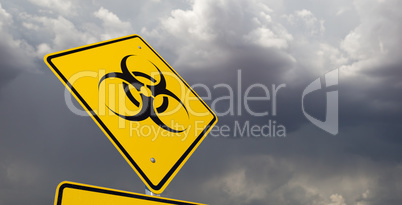Bio-hazard Yellow Road Sign Against Ominous Stormy Cloudy Sky
