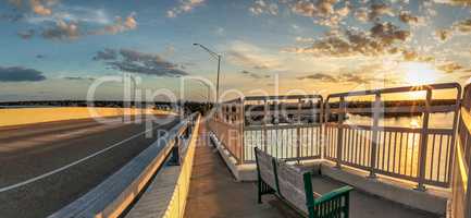 Bench view of a Golden sunset the SS Jolley Bridge into Marco Is