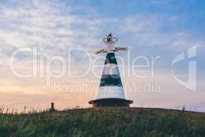 Beacon with the pointer on the hill in sunset light