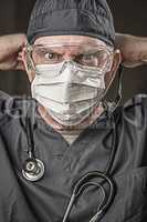 Male Doctor or Nurse Wearing Scrubs, Protective Face Mask and Go
