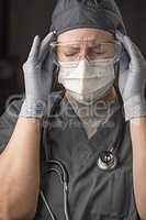 Female Doctor or Nurse Wearing Scrubs, Protective Face Mask and