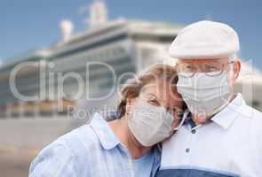 Senior Couple Wearing Face Masks Standing In Front of Passenger