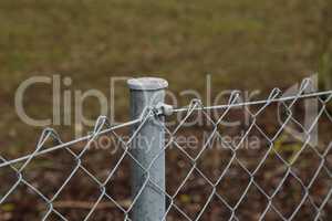 Fence made of metal posts and metal mesh