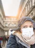 Young Woman Wearing Face Mask Walks Near the Uffizi Gallery In I