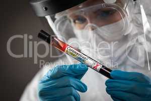 Female Lab Worker Holds Test Tube of Blood Labeled Coronavirus C