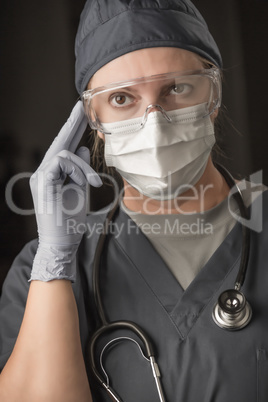 Female Doctor or Nurse Wearing Scrubs, Protective Face Mask and