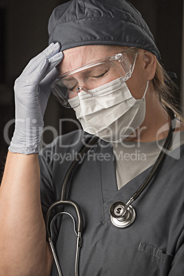 Female Doctor or Nurse Wearing Scrubs, Protective Face Mask and