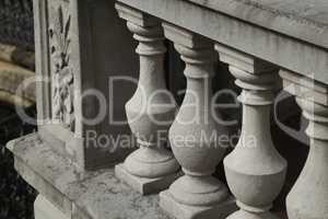 Balustrade of stone columns lit by the sun