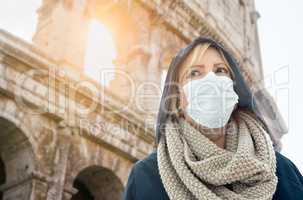 Young Woman Wearing Face Mask Walks Near the The Roman Coliseum