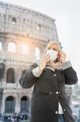 Young Woman Wearing Face Mask Walks Near the The Roman Coliseum