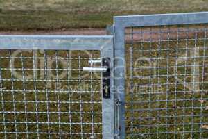 Metal mesh gate with internal lock and handle