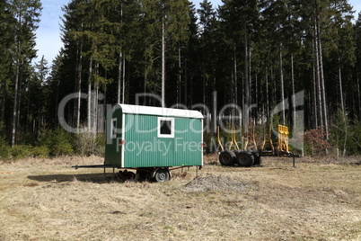 Mobile logger hut stands in the forest