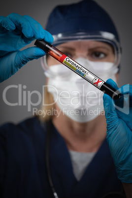 Female Lab Worker Holds Test Tube of Blood Labeled Coronavirus C