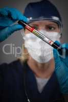 Female Lab Worker Holds Test Tube of Blood Labeled Coronavirus C